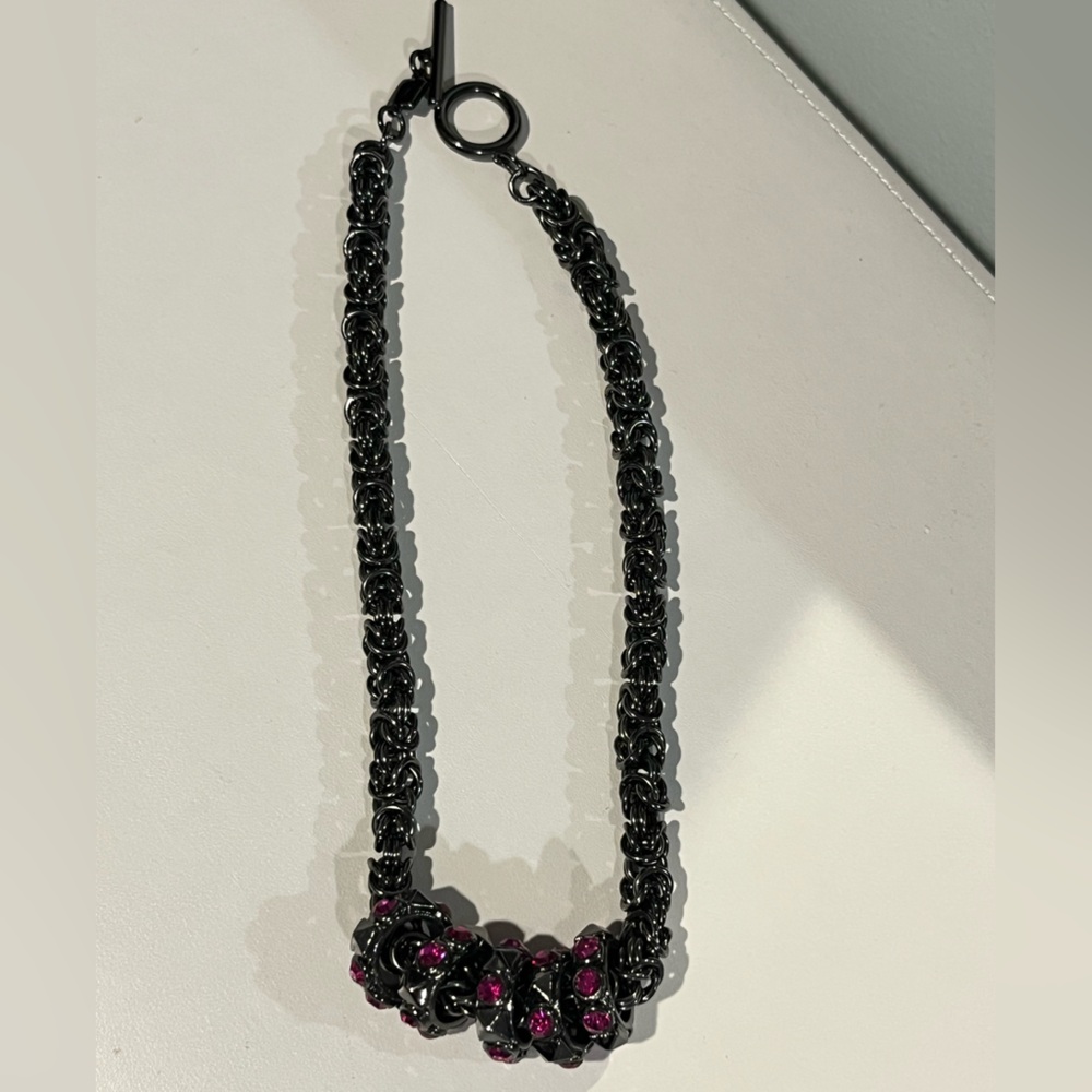 Chunky dark grey necklace with deep pink rhinestones from Givenchy
